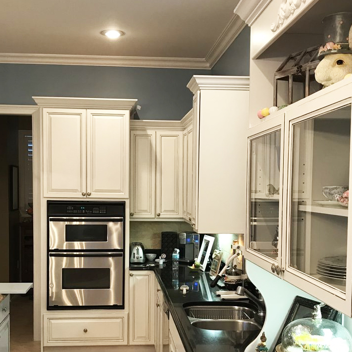 Complete cabinet refacing makes this kitchen bright and modern again!